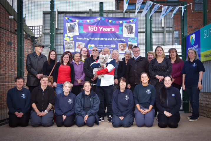 Sir Tony with staff and volunteers