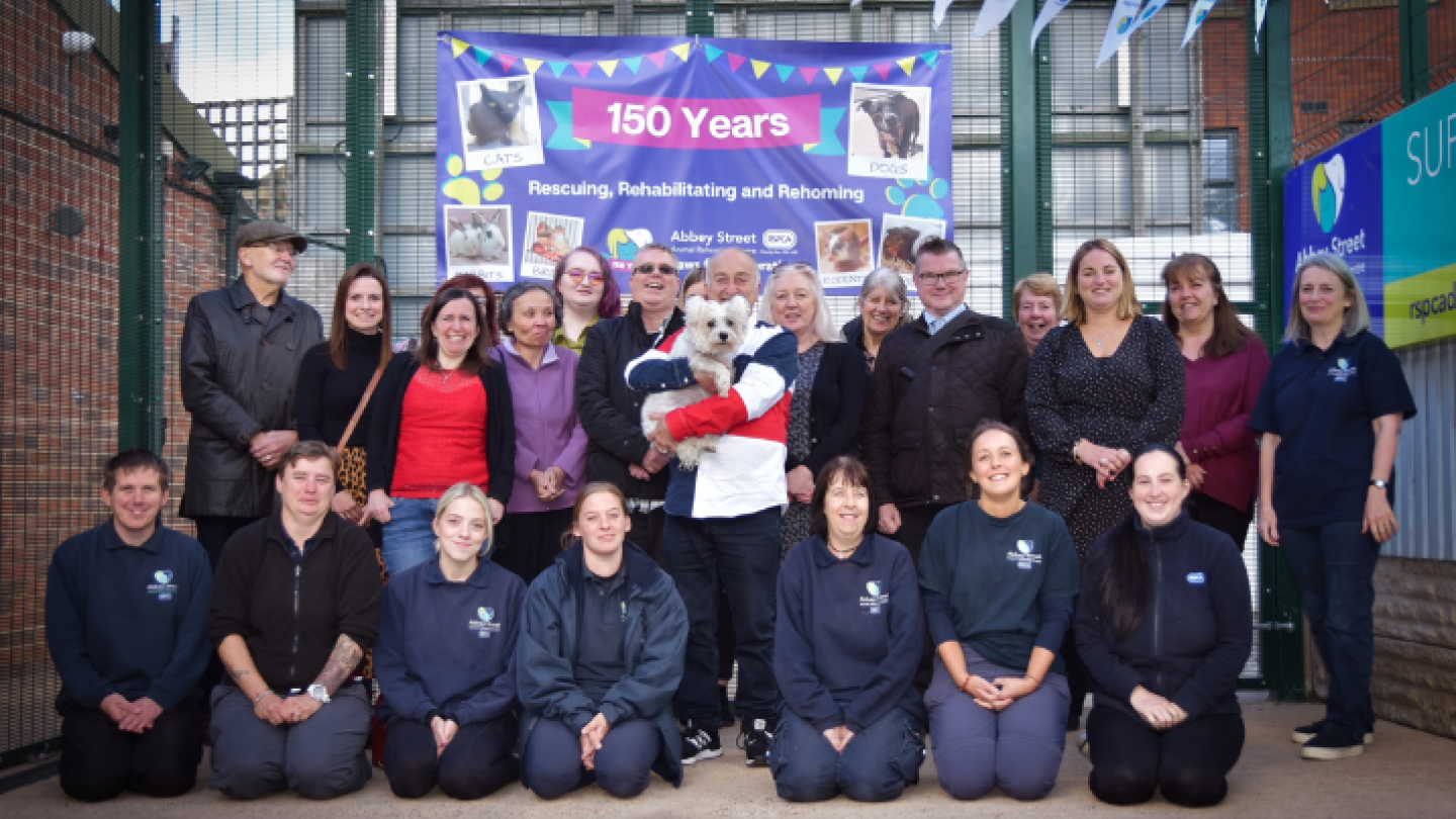 Sir Tony with staff and volunteers